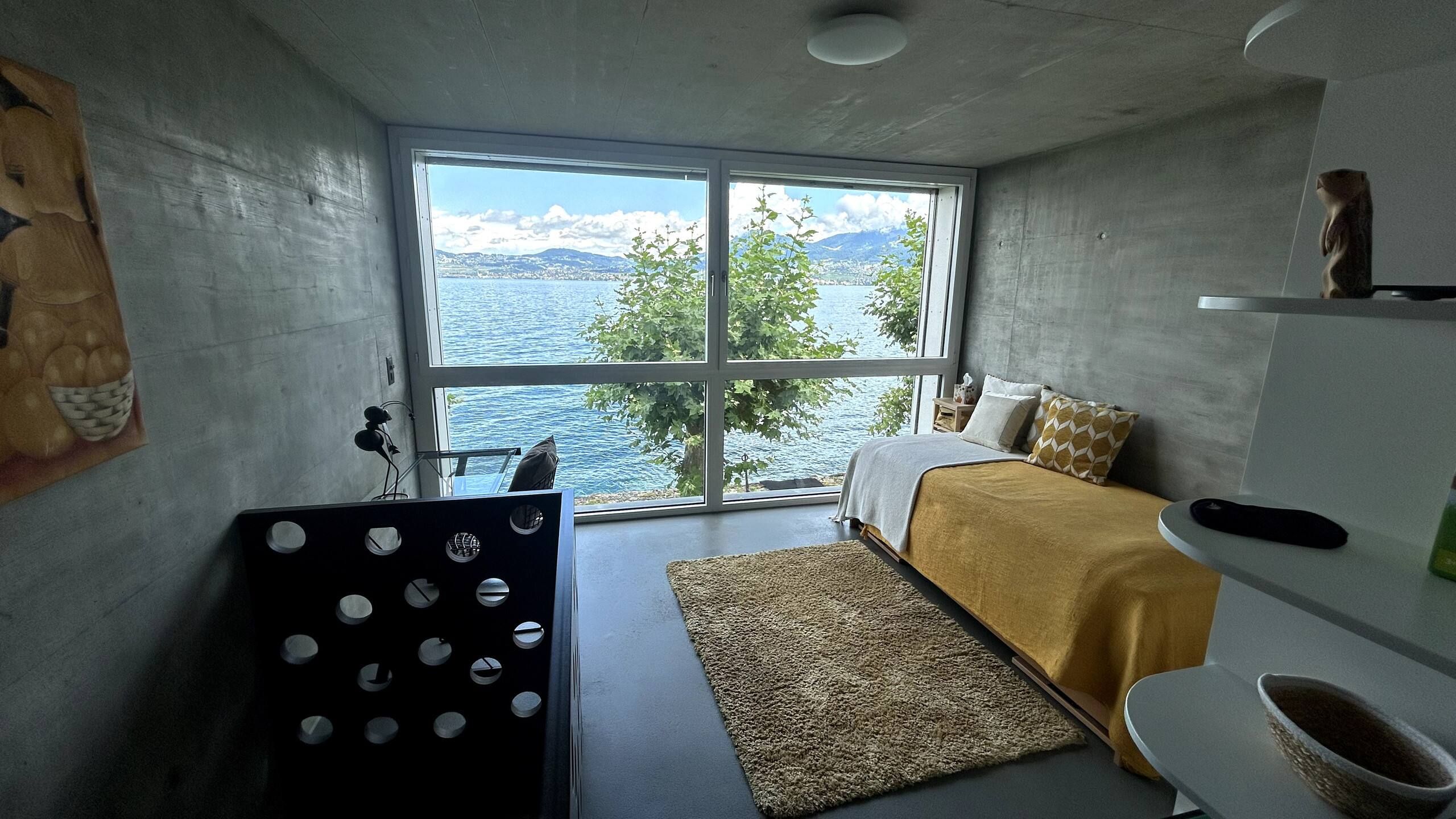 Upstairs room with a large window on the lake