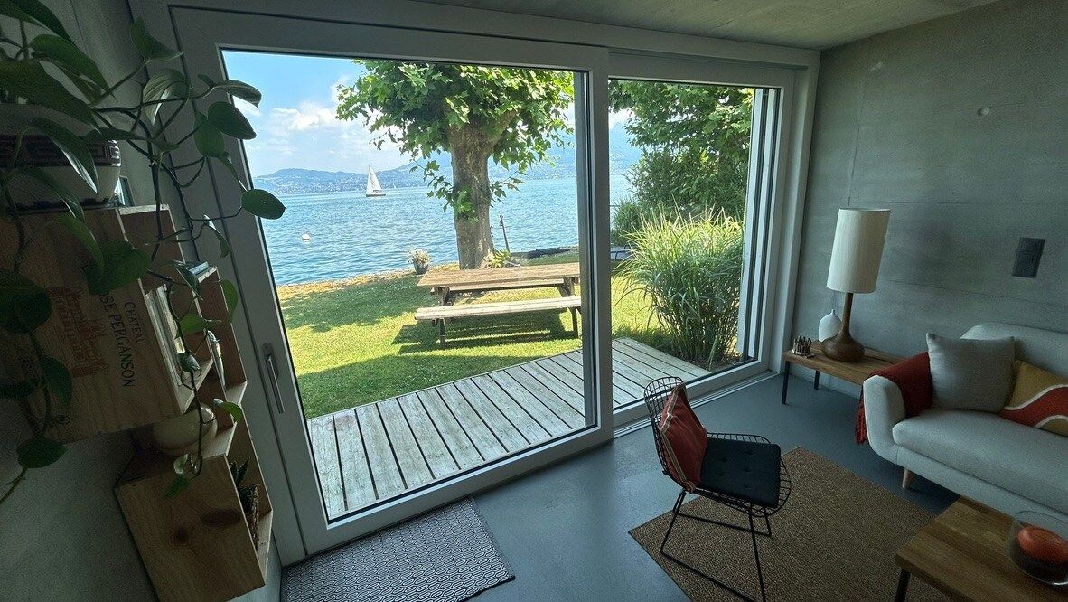 The living room opens onto the deck and the lake